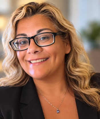 https://www.suzannerutti.com/wp-content/uploads/2026/10/headshot-1-350x417.jpg